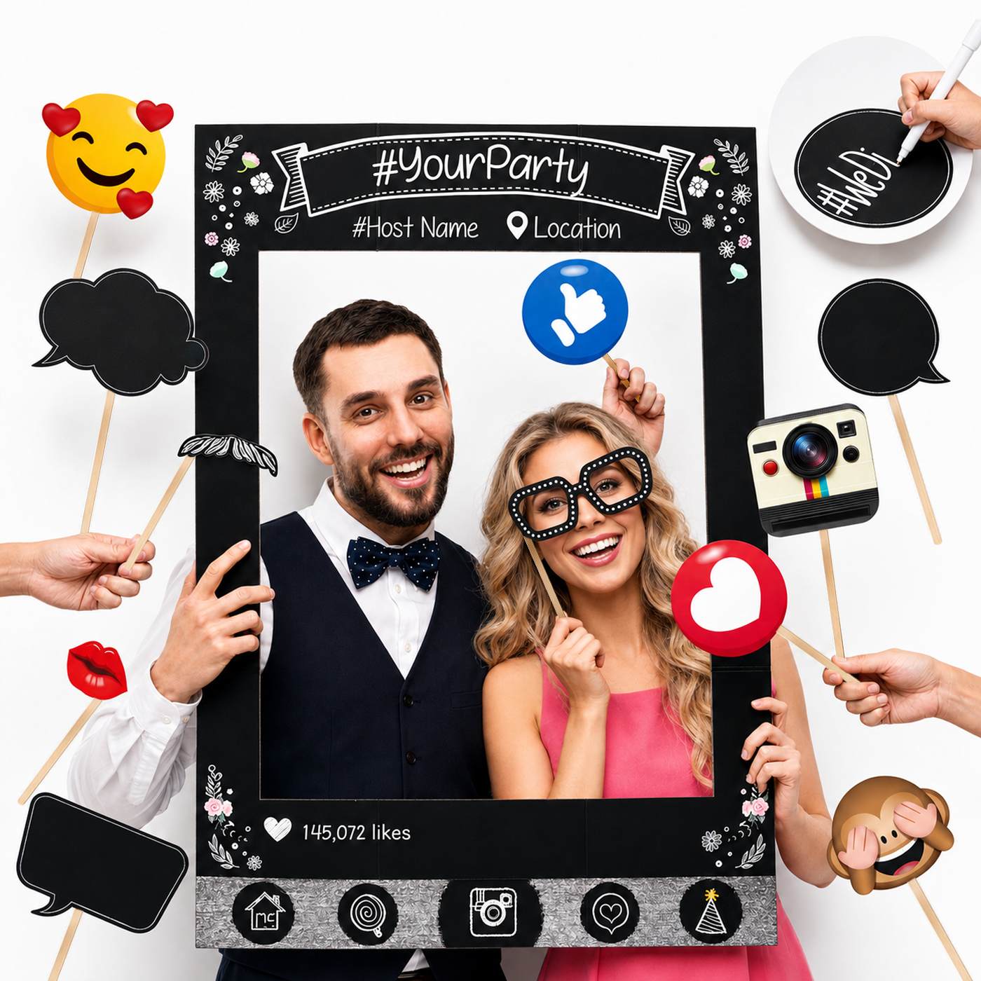 Couple posing inside a social-media party frame with chalkboard photo props